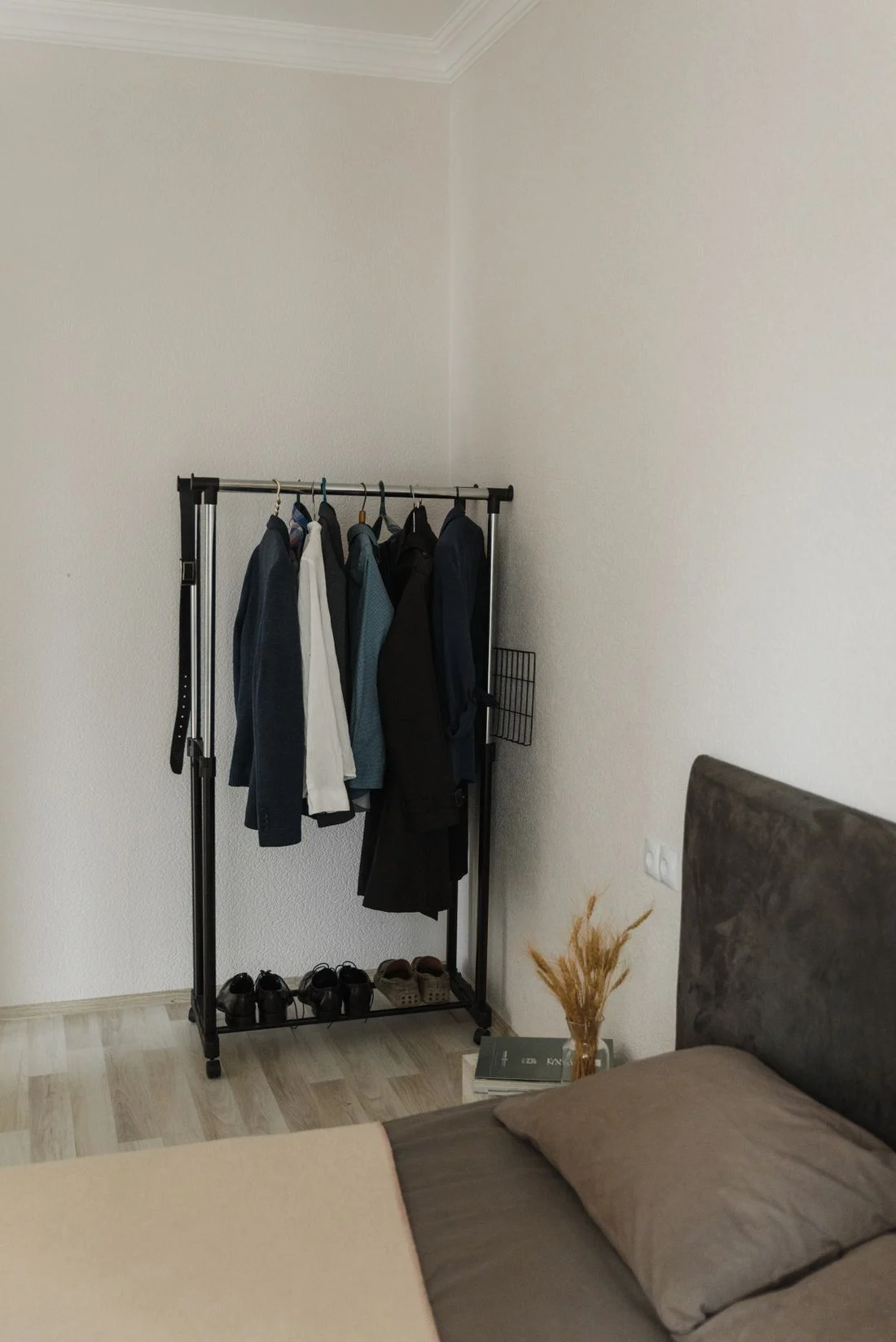 Freestanding garment rack with suits and shoes