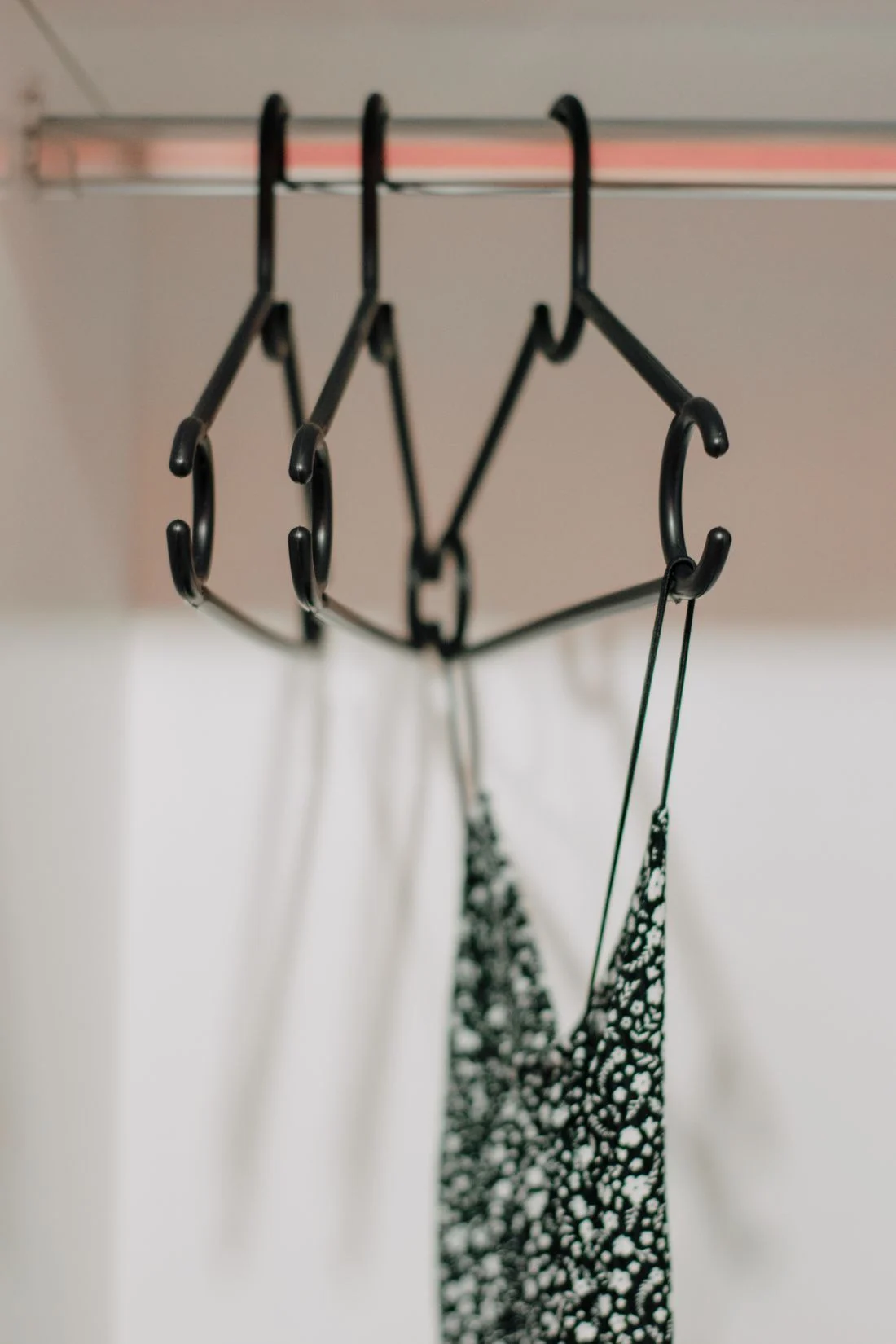 Clothing hanging inside a wardrobe