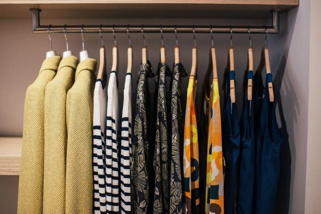 Clothes arranged on a hanging rail
