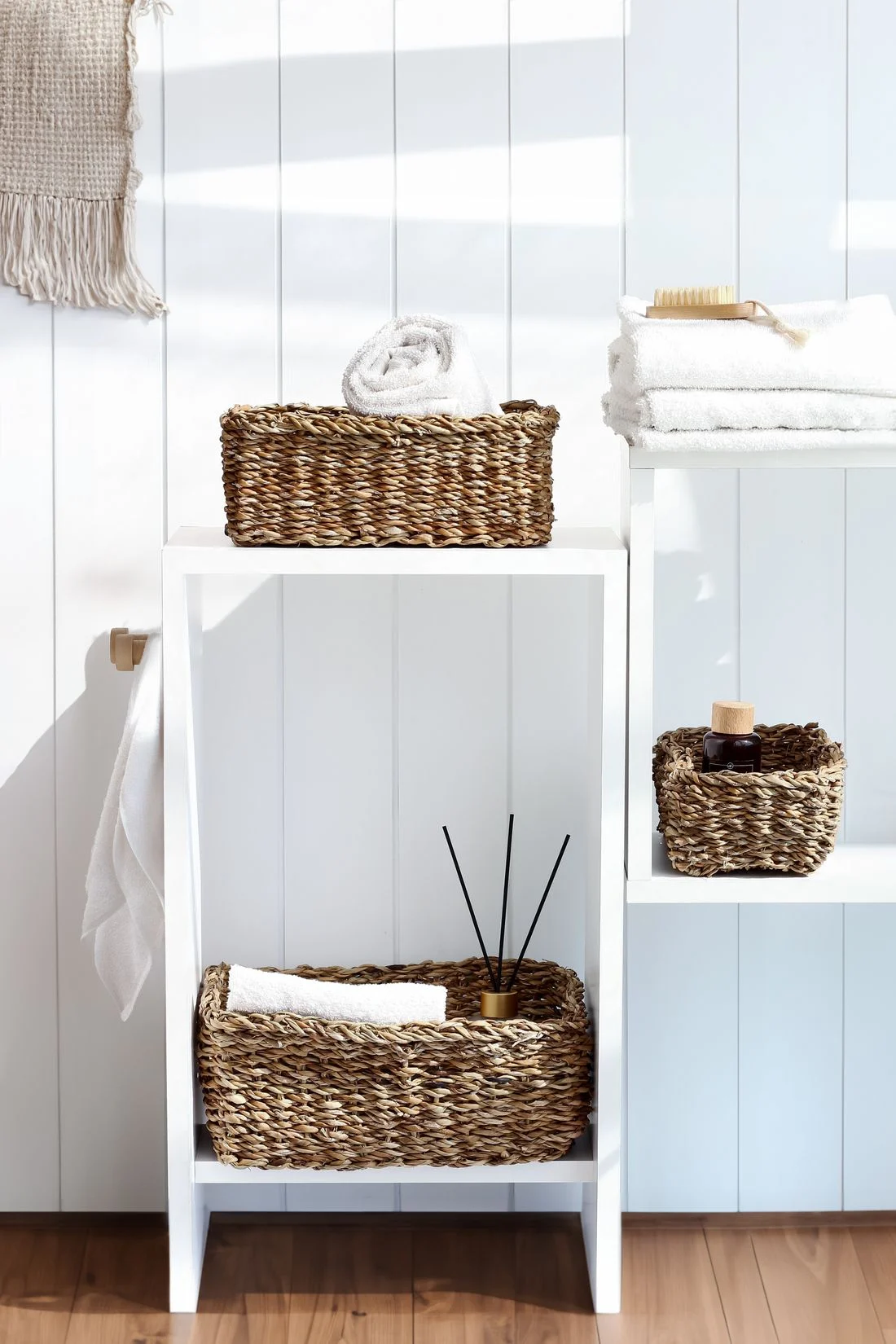 Wicker baskets on bathroom shelves