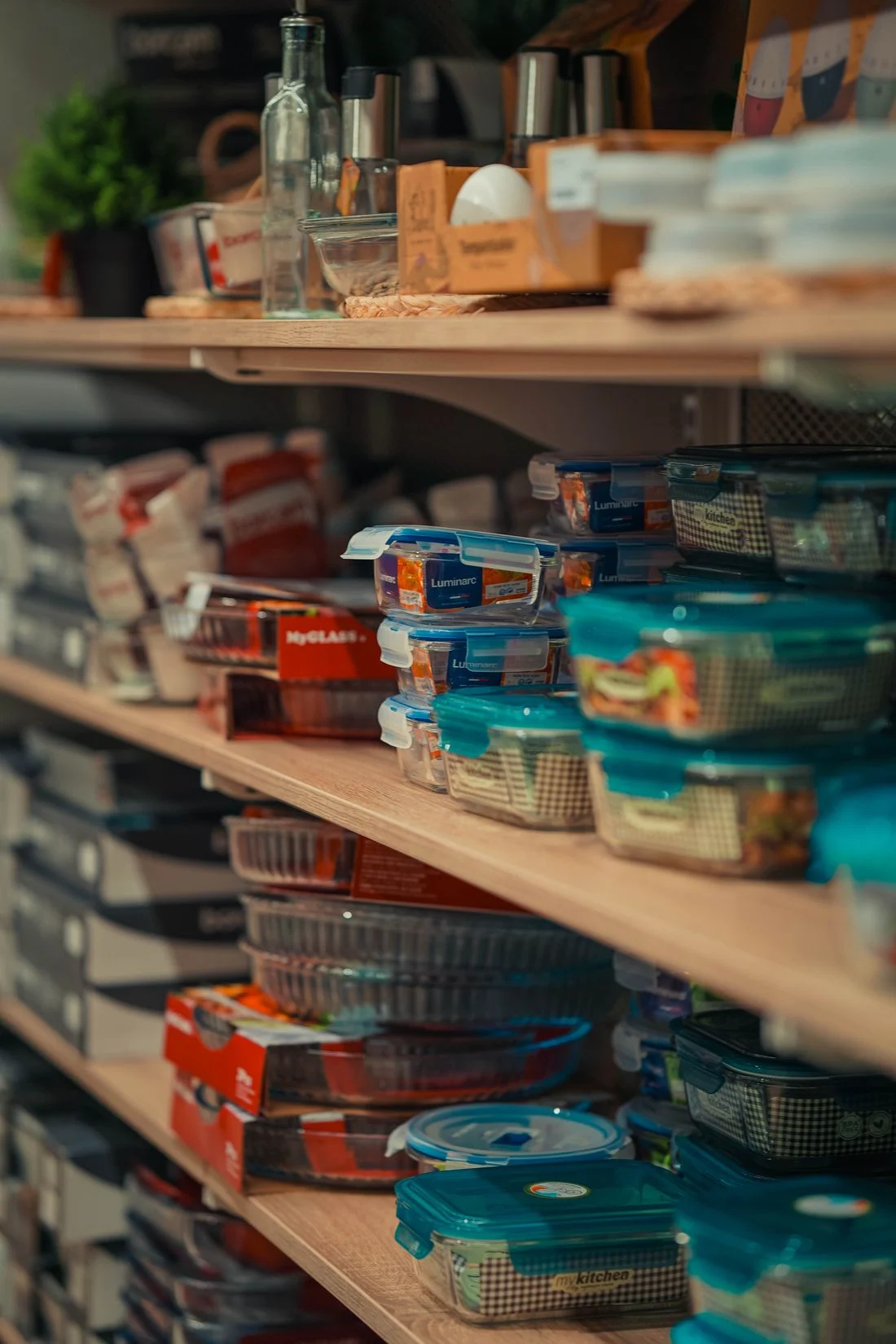 Containers arranged across pantry shelves