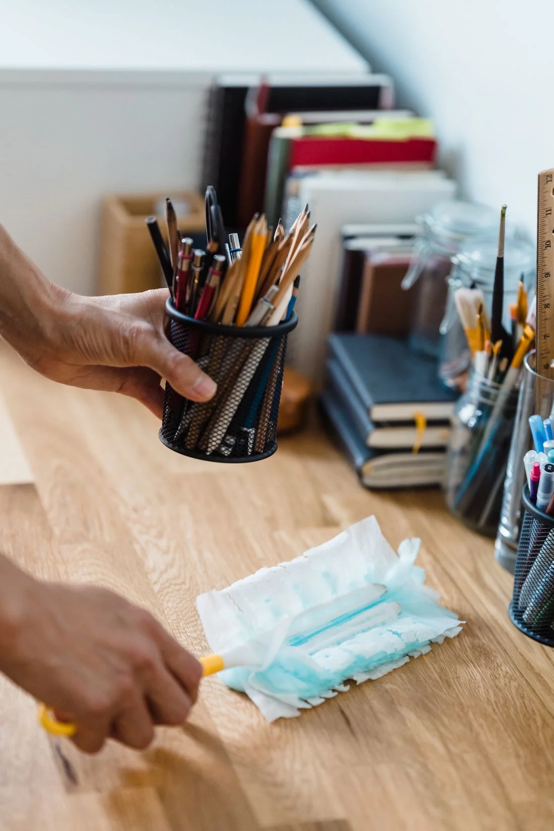 Desk with stationery being cleaned
