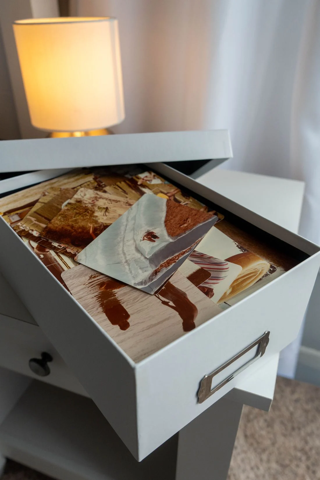 Open memory box with old photographs