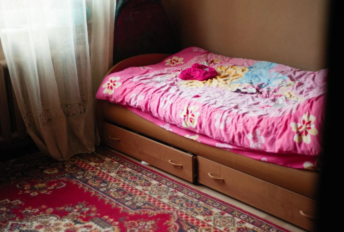 Bed with visible storage drawers