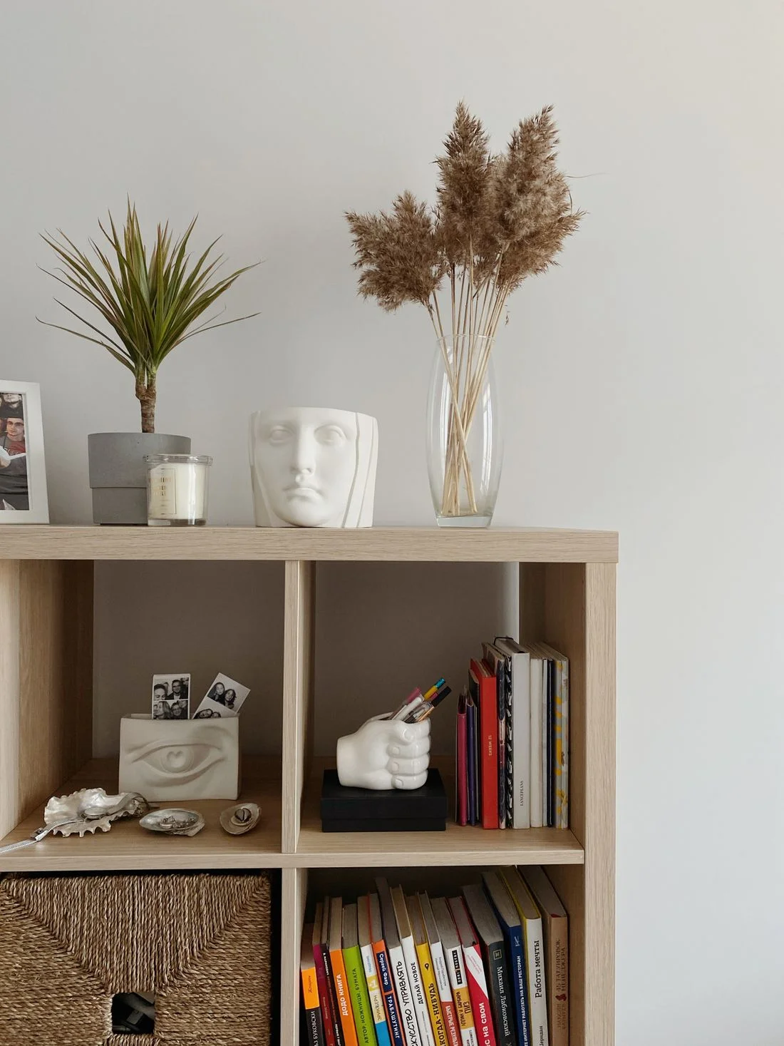Books and small objects on an open shelf
