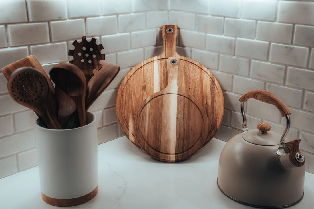 Wooden cooking utensils in a kitchen holder