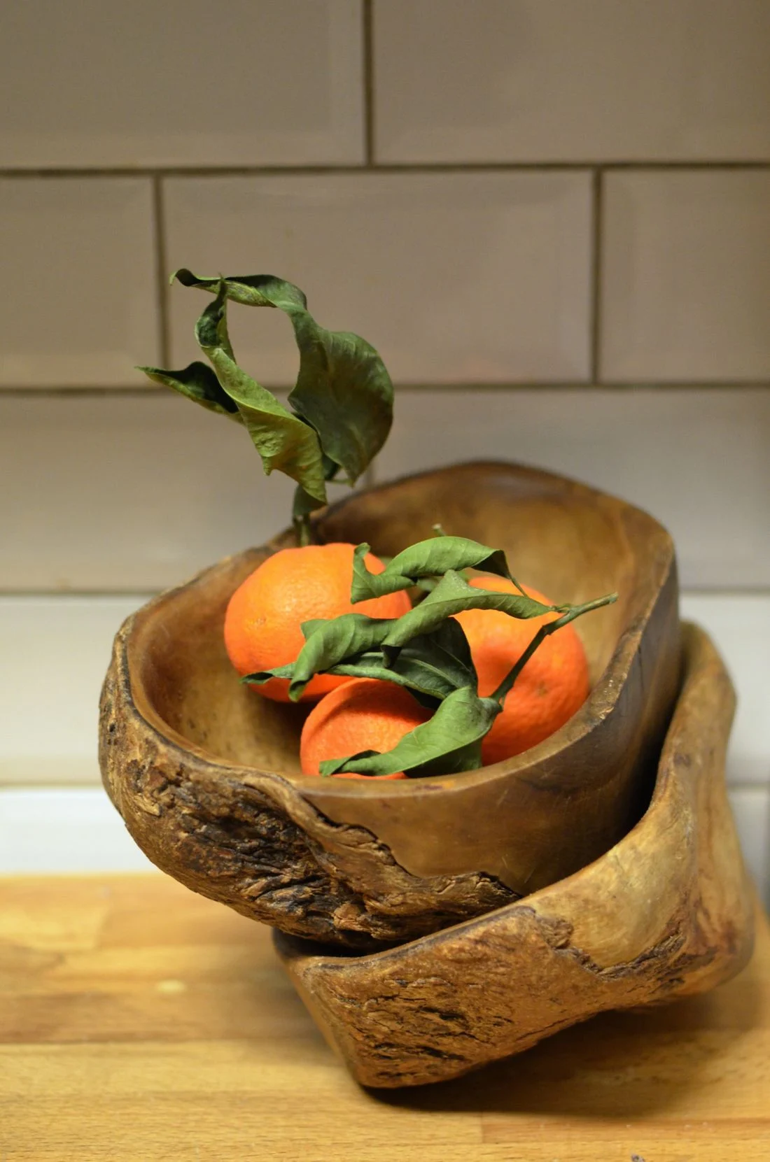 Oranges displayed in a bowl