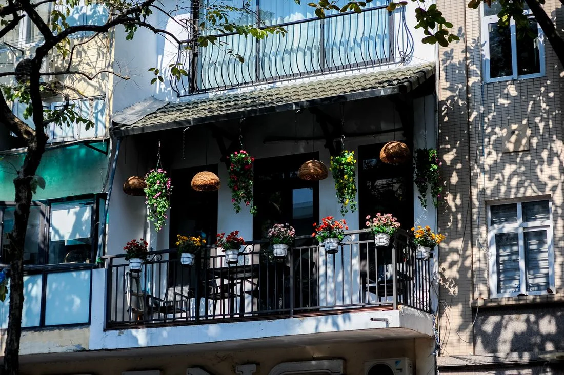 Balcony with flower pots and outdoor seating